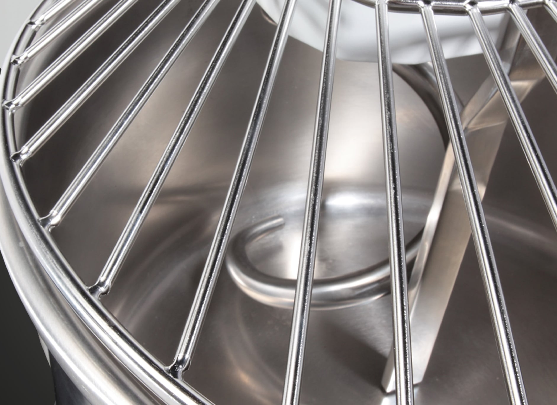 Commercial spiral mixer in a professional bakery environment with dough in bowl