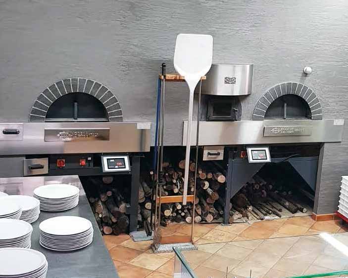 Two MAM Milano pizza ovens installed side by side on a restaurant line