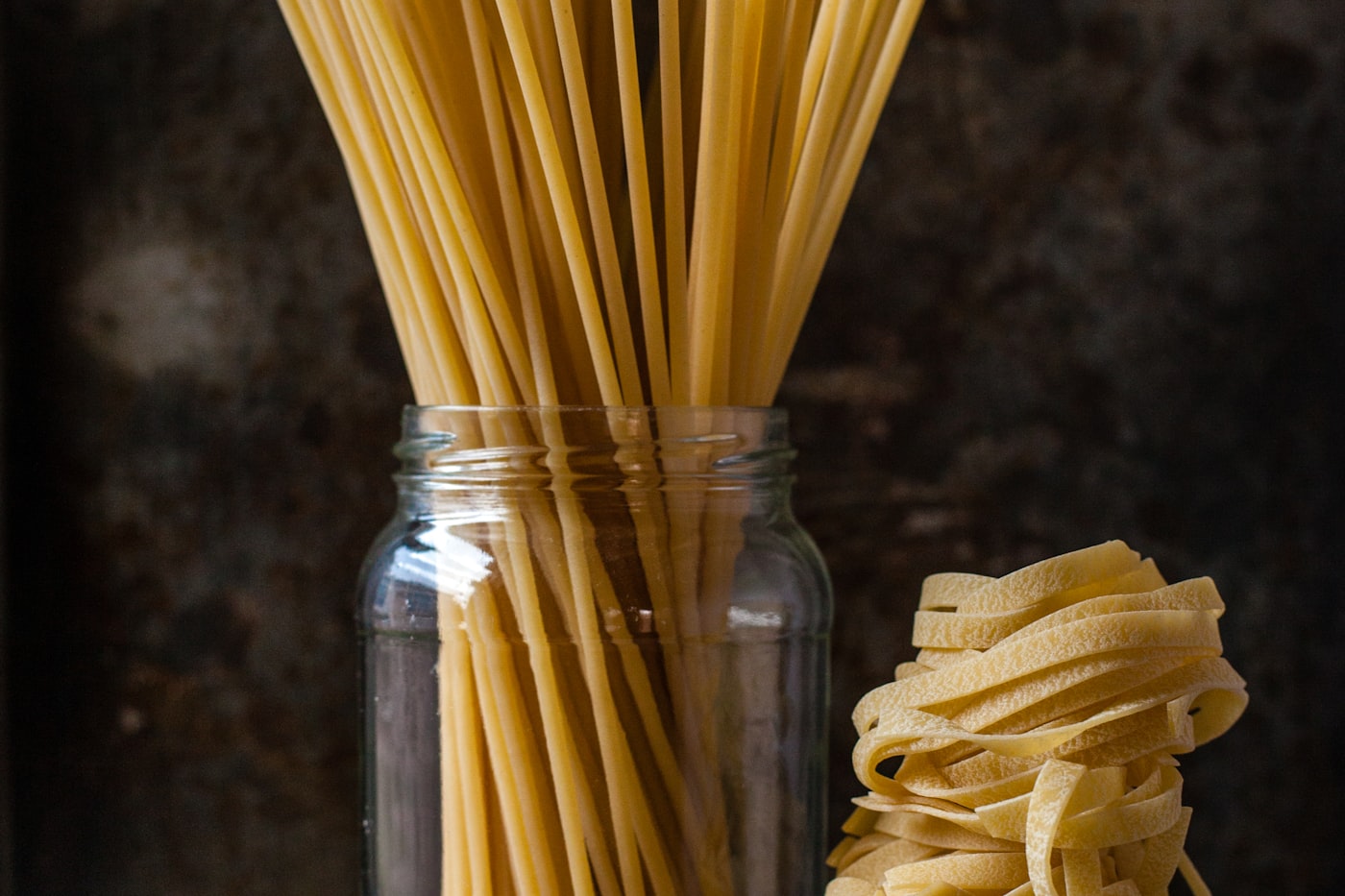 Various fresh pasta shapes — spaghetti and tagliatelle — produced with interchangeable Italgi dies